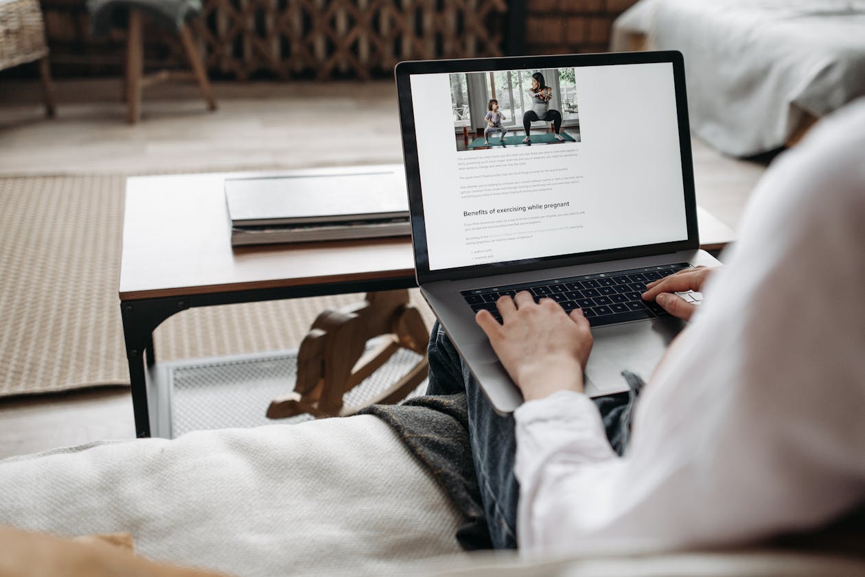 Person working remotely on a laptop in a cozy home office environment, demonstrating remote work benefits