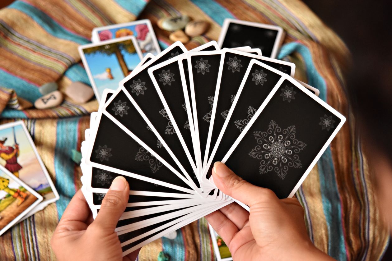 Close-up of tarot card reading session showing how to read tarot cards using the pareidolia method
